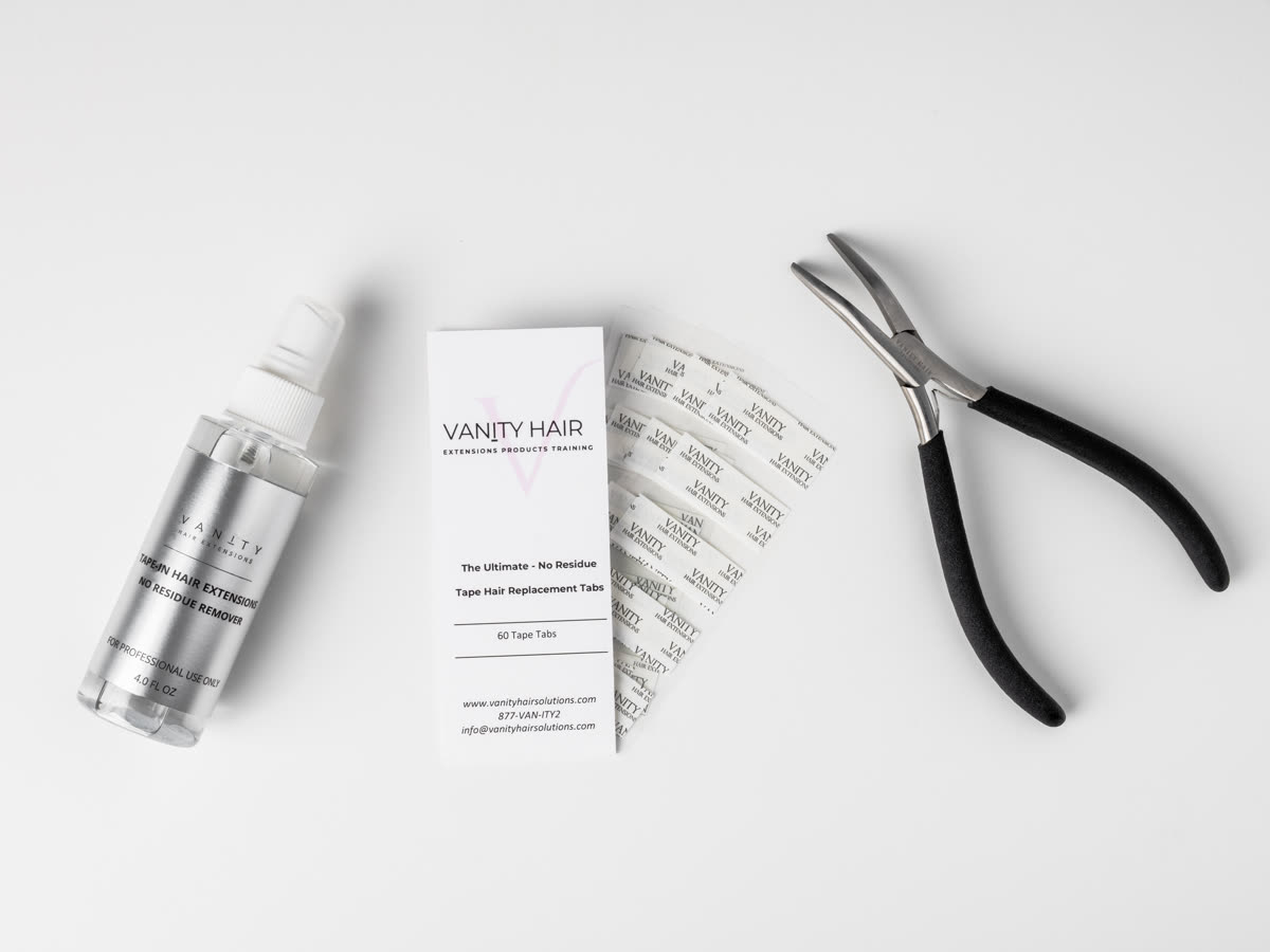 The full Vanity kit laid out — remover bottle, tab card and application pliers